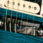Does a guitars bridge affect its tone